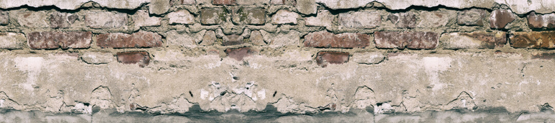 Panorama old damaged brick wall with shabby plaster.