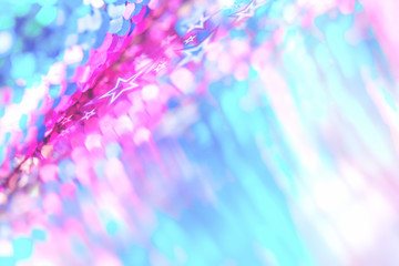 Sparkling glitter abstract background purple blue desaturated color, fluid defocused, macro. Sequins sparkling over silver stars, tender pastel bokeh. party festive background