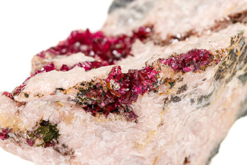Macro stone Erythrite mineral on white background