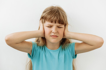 Frustrated and stress emotion. Portrait of 9 year girl against white background
