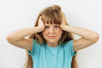 Frustrated and stress emotion. Portrait of 9 year girl against white background