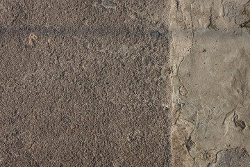 The texture of the cement is lighted with sunlight. Close-up Top view. Background