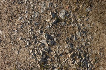 Ground road with fine gravel View from the top. Close-up Background