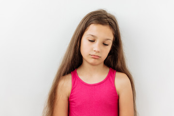 Sad,Tired,boredom and exhausted emotion 9 year girl portrait against white background