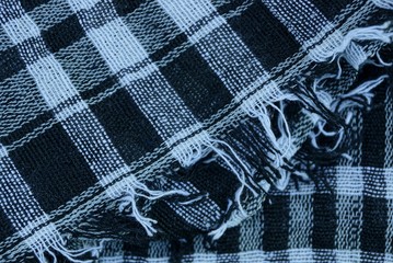 black white checkered fabric texture on a woolen piece of clothing 