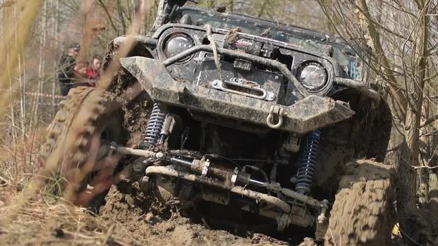 Off Road Expedition Vehicle on the Muddy Forest Trail. Extreme Motorsport.