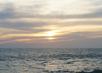 Bright contrast saturated sunset on the ocean on the southern tropical coast.