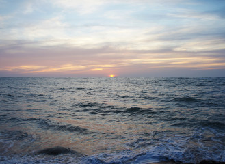 Bright contrast saturated sunset on the ocean on the southern tropical coast.