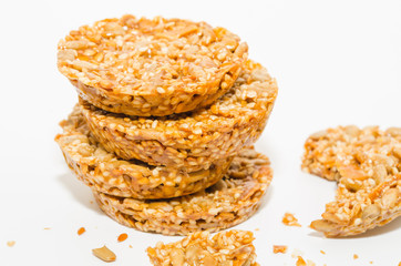 Healthy diet snack close-up. Cereal cookies with nuts isolated on a white background. 