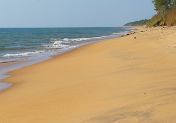 Sunny sandy coast on the ocean on the southern tropical island of Sri Lanka.