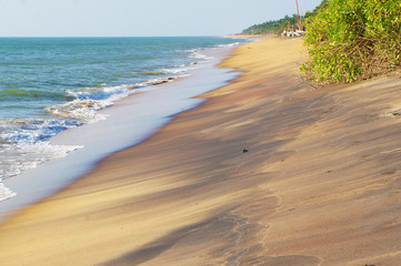 Sunny sandy coast on the ocean on the southern tropical island of Sri Lanka.