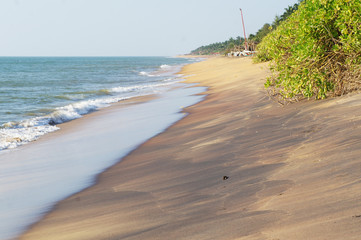 Sunny sandy coast on the ocean on the southern tropical island of Sri Lanka.