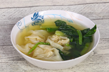 Asian traditional Wonton soup with herbs