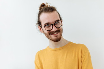 Bearded guy in glasses portrait against white background. Laughter and joy emotions