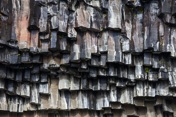 Black basalt columns of Reynisfjara look like huge pencils, a world-famous black-sand beach found on the South Coast of Iceland.