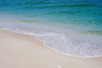 Beach, sand and ocean waves and blue sky in the morning, Phan Thiet beach vacation in Vietnam