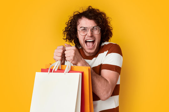 Excited Male With Shopping Bags