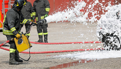 firefighter extinguishing with foam