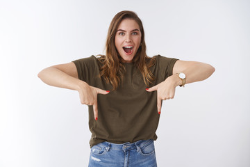 Impressed overwhelmed attractive adolescent 25s woman wearing casual outfit drop jaw amused...