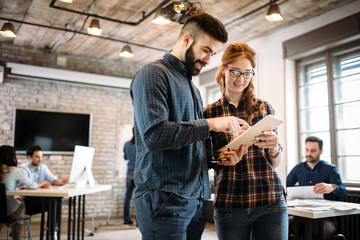 Portrait of architects having discussion in office