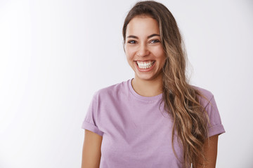 Charismatic carefree attractive healthy woman laughing out loud smiling white teeth giggling having fun, enjoying awesome friendly company watching comedy, chuckling funny joke, white background