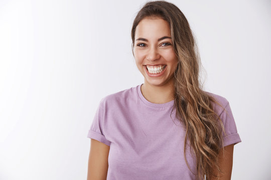 Charismatic carefree attractive healthy woman laughing out loud smiling white teeth giggling having fun, enjoying awesome friendly company watching comedy, chuckling funny joke, white background