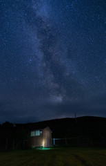 Fototapeta na wymiar Milky Way rising in a rural area in Isle of Skye, Scotland.