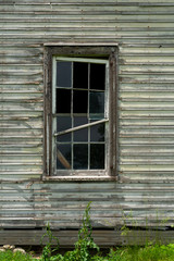 Fototapeta na wymiar Window on old farmhouse