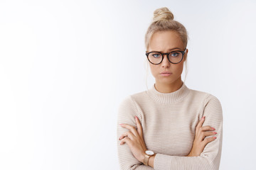 Woman showing disbelief looking suspicious not believing single word crossing arms over chest...