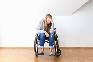 Despair young woman on wheelchair. Hard invalid concept.