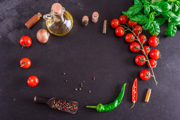 Ingredients for preparation of tasty Italian pizza. Cherry tomato, spices, basil, chili pepper