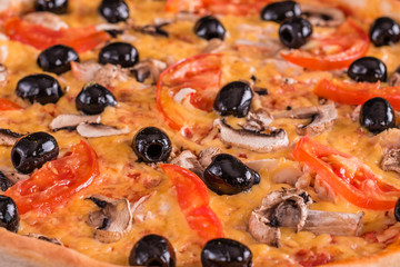 Tasty fresh hot pizza against a dark background. Pizza, food, vegetable, mushrooms