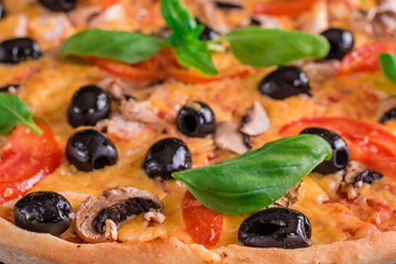 Tasty fresh hot pizza against a dark background. Pizza, food, vegetable, mushrooms