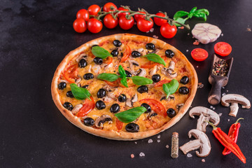 Tasty fresh hot pizza against a dark background. Pizza, food, vegetable, mushrooms