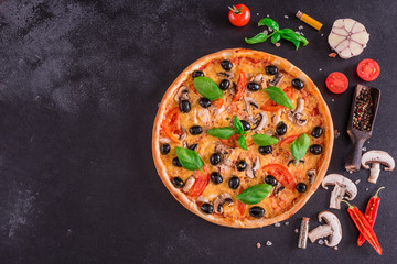 Tasty fresh hot pizza against a dark background. Pizza, food, vegetable, mushrooms