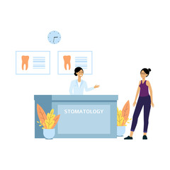 Female patient at dentist clinic reception desk. Friendly receptionist welcomes client to doctor's dental office