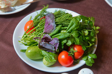 Ingredients: tomato, cucumber, basil, chrysanthemums, strawberries, peas. Caviar salad is in the plate.