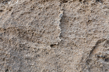 Detalhe da textura de pedra castanha abstrata. Para plano de fundo, texturas, designs de produtos. Fundo natural para ser usado em contexto de arquitetura antiga como papel de parede áspero.