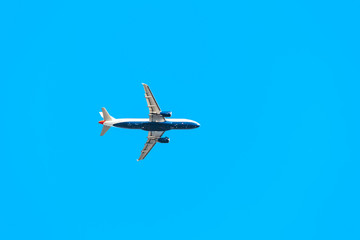 Flying airplane bottom view