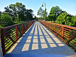 Iron and concrete footbridge into the park in Sapulpa, Oklahoma. Small town USA.