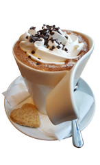 A cup of coffee. Coffee with whipped cream and chocolate crumbs