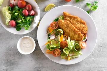 Vegetable salad and schnitzel