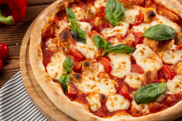 Flyer and poster for Restaurants or pizzerias, template with delicious taste margarita pizza, mozzarella cheese, cherry tomatoes.