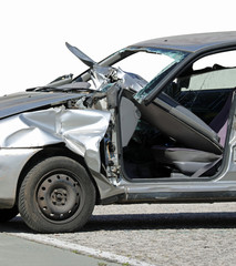 completely destroyed vehicle with broken windshield