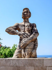 Obraz premium Ataturk is a protector of children, a monument to the ataturk, which protects the boy.