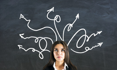 Portrait of businesswoman with arrows