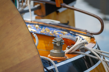 Old vintage sailboat with ropes and winch