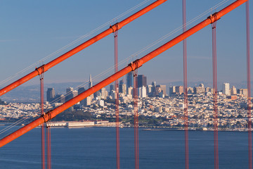 Golden Gate Bridge close-up with San Francisco skyline in background