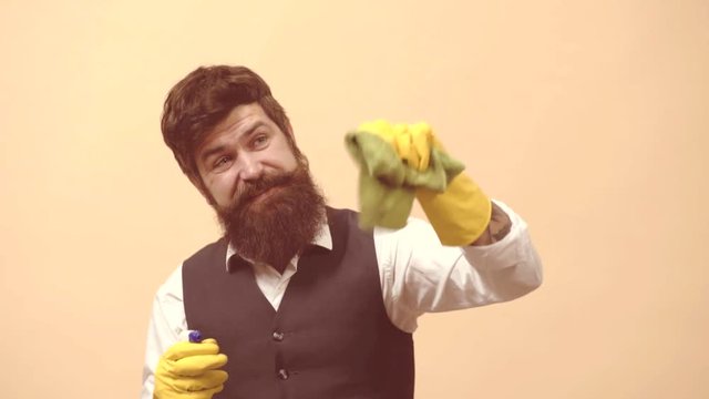 Cleaning service man. Professional window cleaner. Bearded man with cleaning agents working. Portrait of man with cleaning equipment cleaning the house.