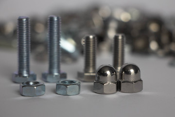 two nuts and two deaf nuts. Cap nuts, four bolts on the back plate and a mountain of nuts and bolts.